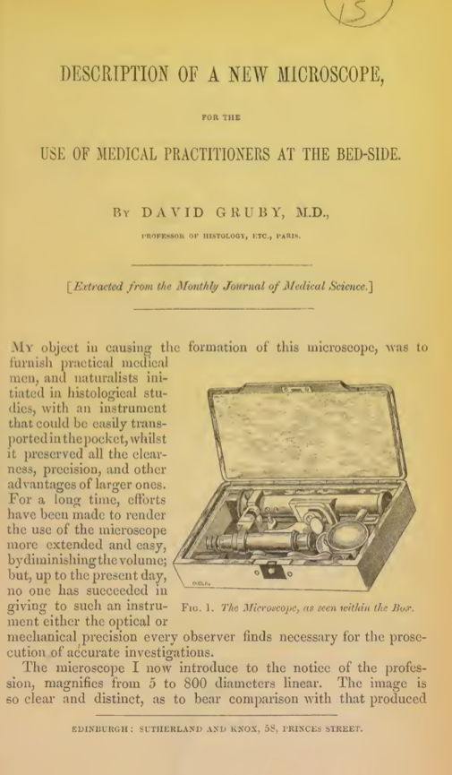 A book with a picture of a microscope in it
Description automatically generated