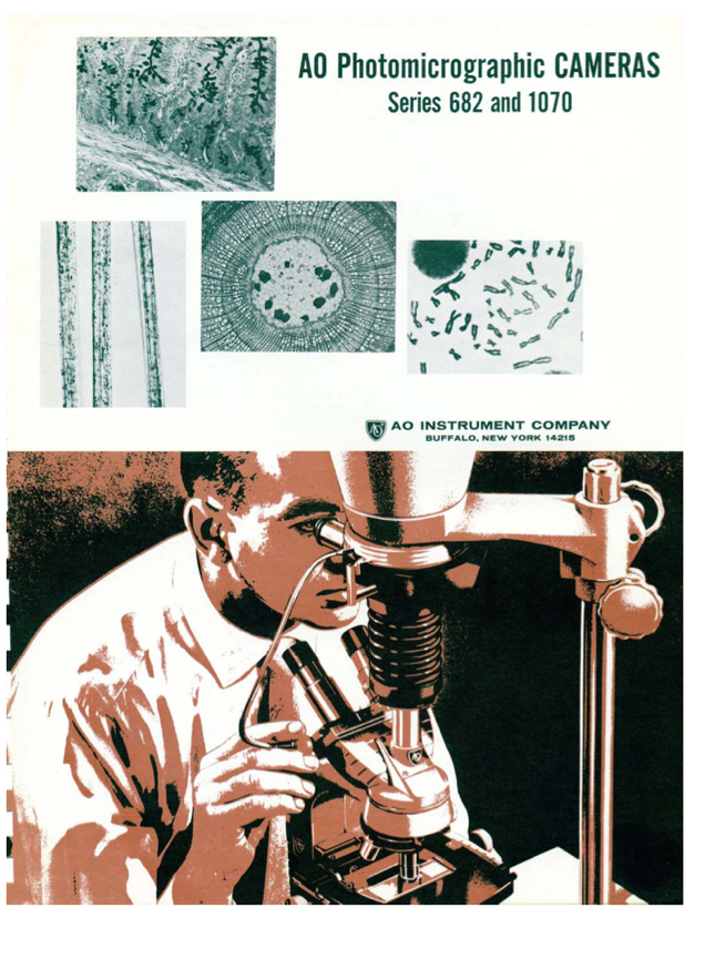 A person looking through a microscope
Description automatically generated