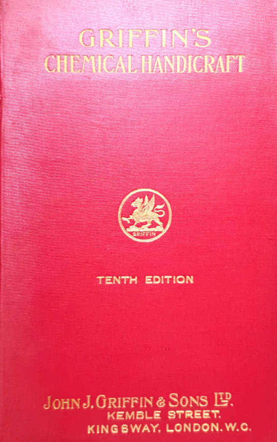 A red book with gold text
Description automatically generated