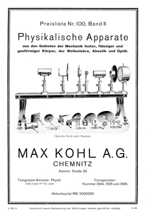 A black and white poster of a scientific apparatus
Description automatically generated