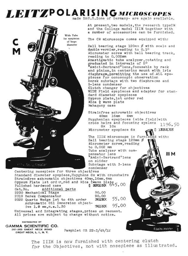 A black and white photo of a microscope
Description automatically generated