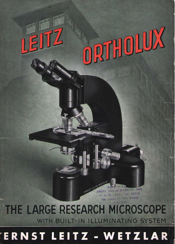 A black microscope with red text
Description automatically generated