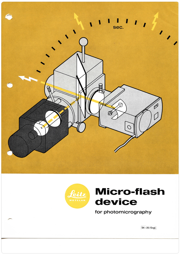 A yellow and black drawing of a camera
Description automatically generated