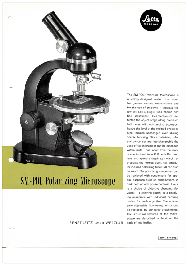 A black and silver microscope
Description automatically generated