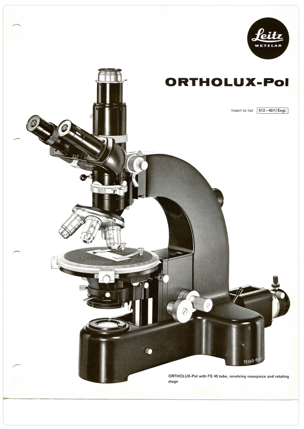 A black and white photo of a microscope
Description automatically generated
