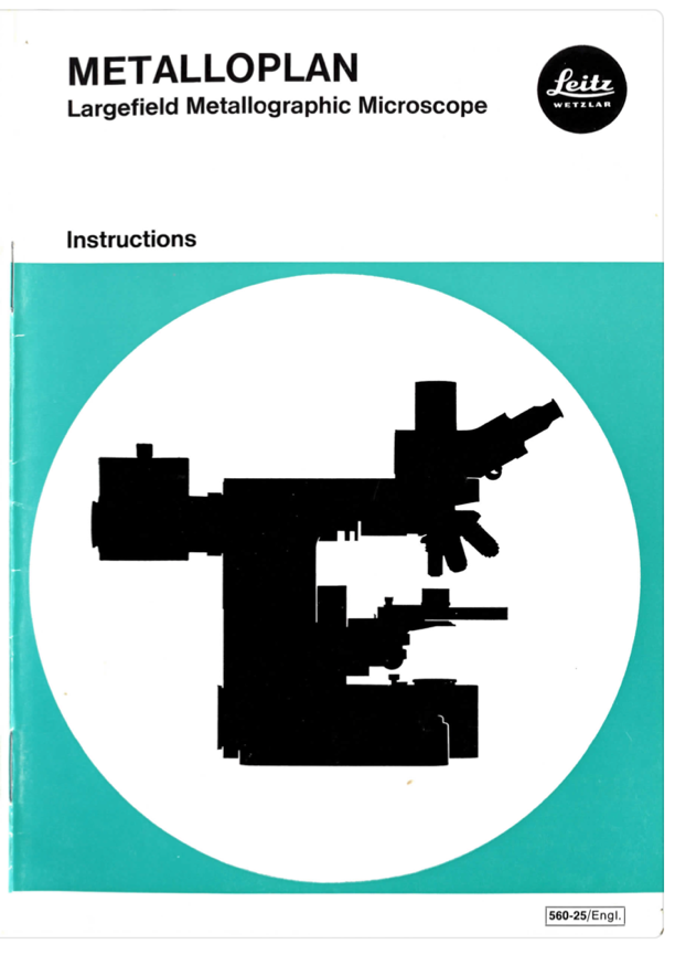 A book with a black silhouette of a microscope
Description automatically generated