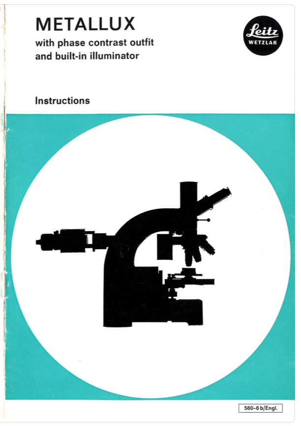 A book with a microscope
Description automatically generated