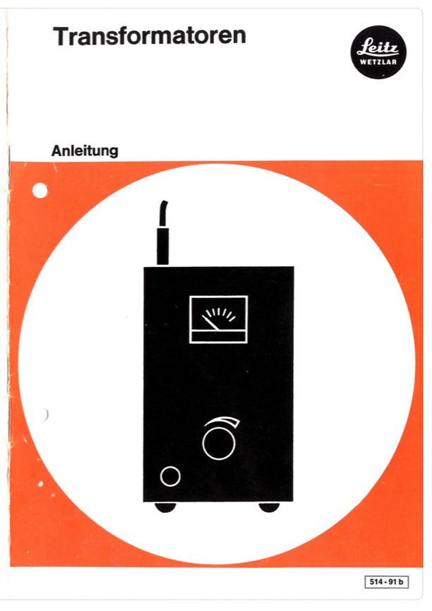 A black and white sign with a black and white picture of a device
Description automatically generated