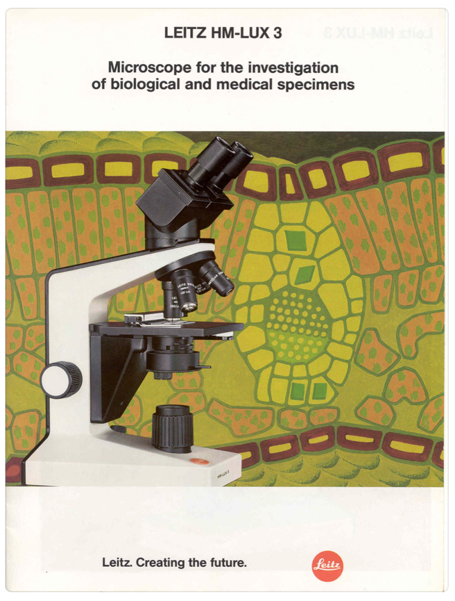 A white and black microscope
Description automatically generated