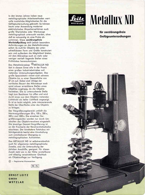 A black and silver microscope
Description automatically generated