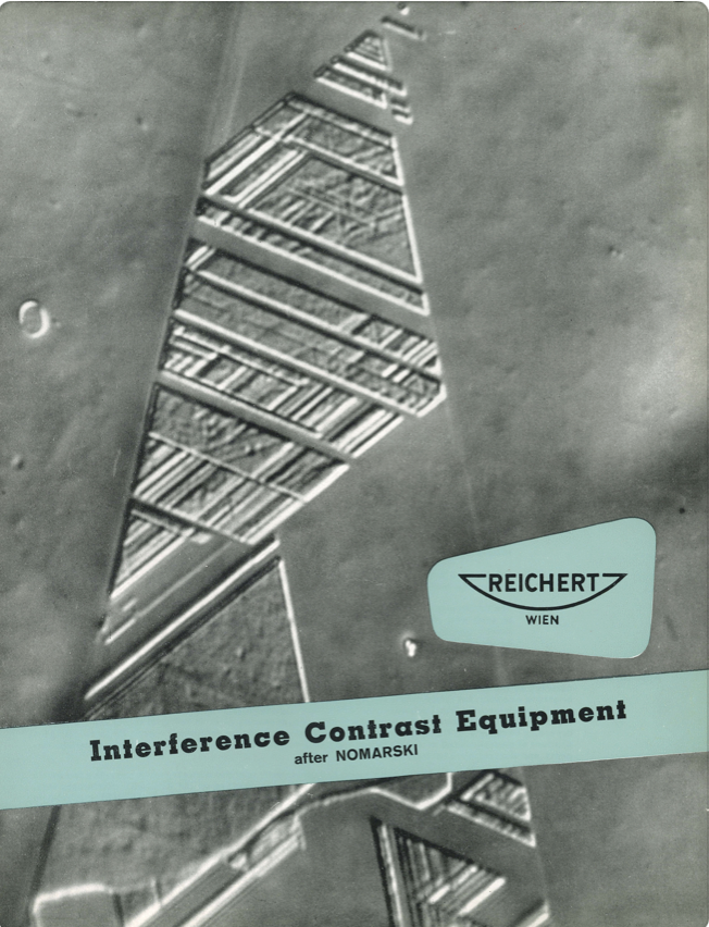 A book cover with a triangle pattern
Description automatically generated