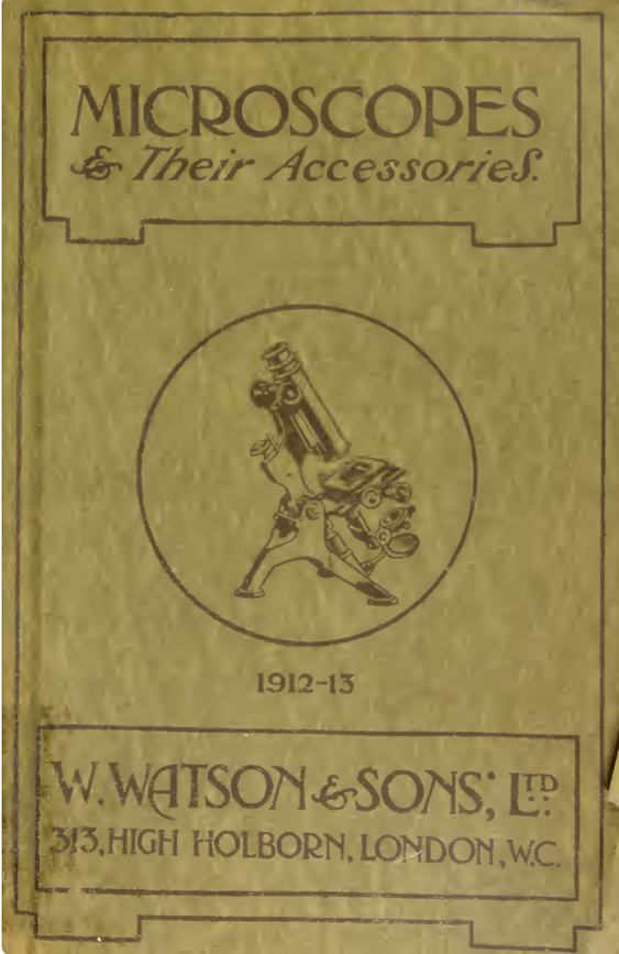 A brown and black book with a picture of a microscope
Description automatically generated