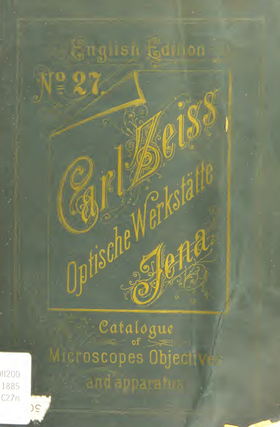 A green book with yellow writing
Description automatically generated