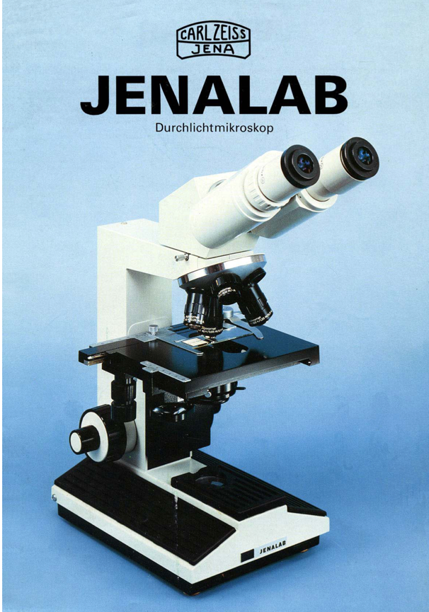 A white and black microscope
Description automatically generated
