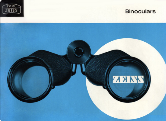 A black binoculars on a blue background
Description automatically generated