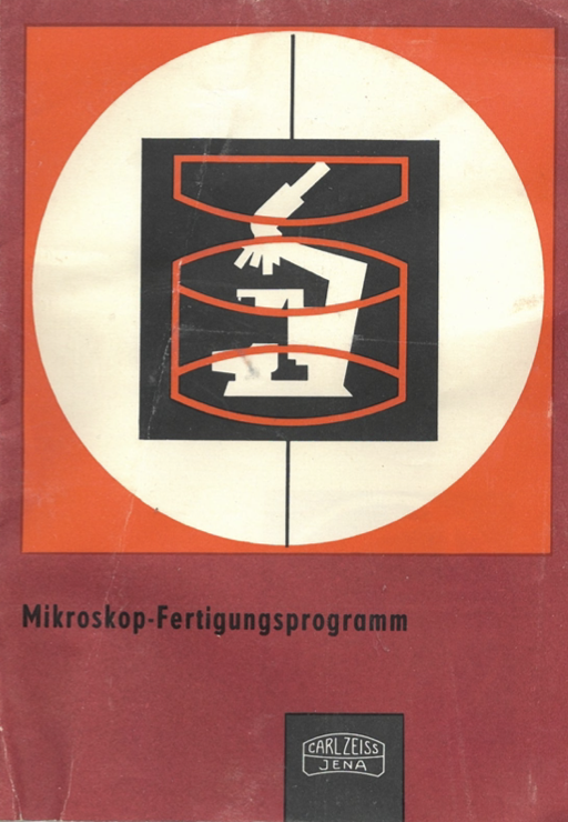 A red and white sign with a microscope
Description automatically generated