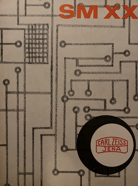 A black and white drawing of a circuit board
Description automatically generated