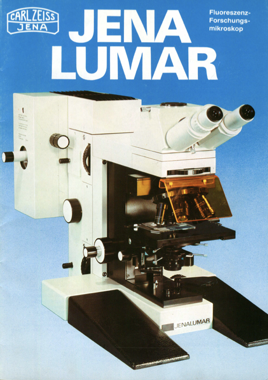 A white and black microscope
Description automatically generated