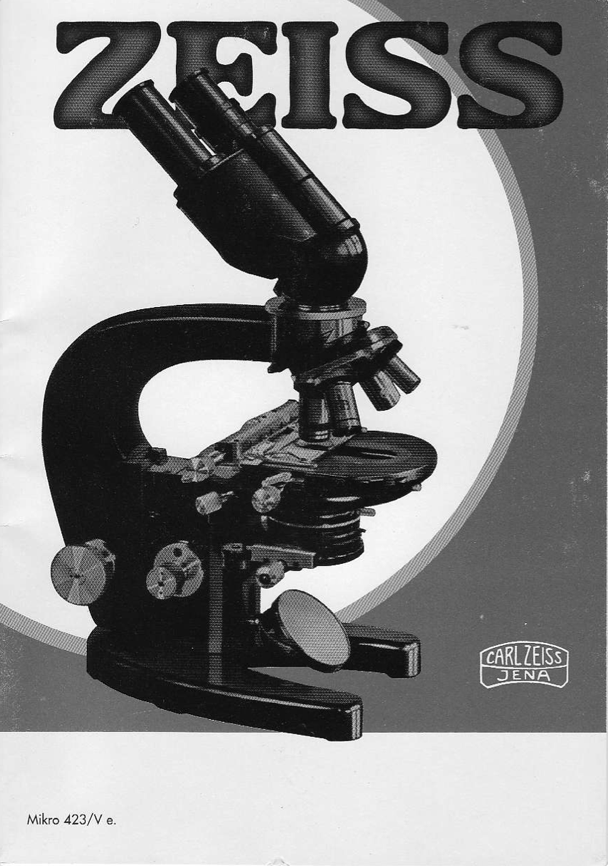 A black and white cover with a microscope
Description automatically generated