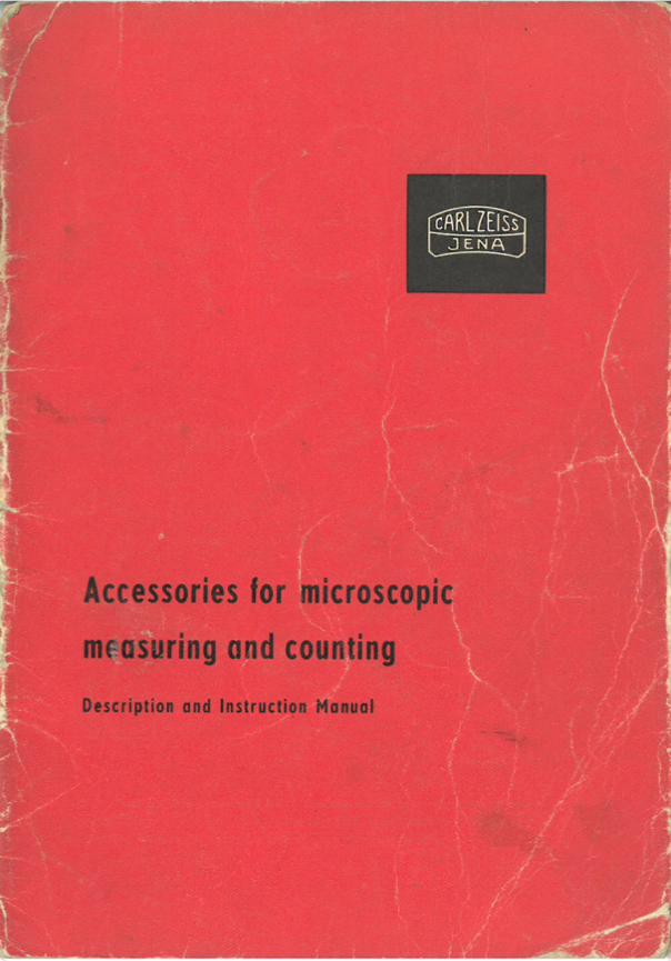 A red book with black text
Description automatically generated