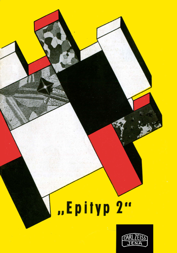 A yellow cover with a black red and white and black geometrical figure
Description automatically generated