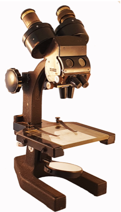 A close-up of a microscope
Description automatically generated