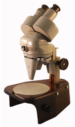 A close-up of a microscope
Description automatically generated