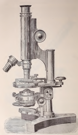 A picture containing indoor, wall, old, microscope
Description automatically generated