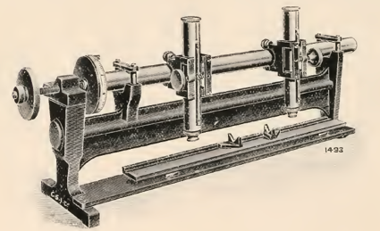 A picture containing photo, old, sitting, table
Description automatically generated