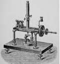 A picture containing appliance, indoor, table, sitting
Description automatically generated