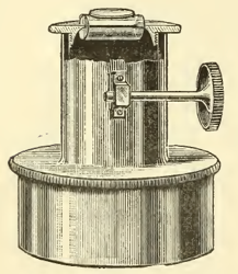 A picture containing table, sitting, old, clock
Description automatically generated