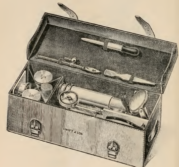 A pile of luggage stacked on top of a suitcase
Description automatically generated