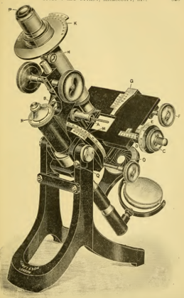 A picture containing object, motorcycle, photo, old
Description automatically generated