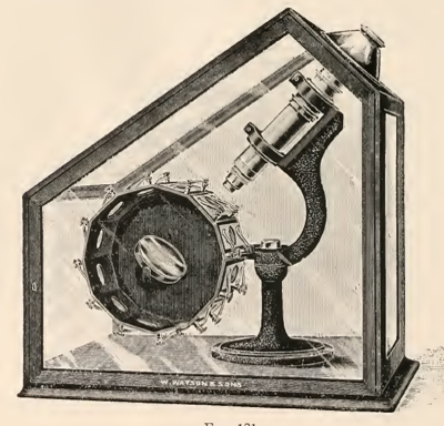 A picture containing photo, clock, sitting, old
Description automatically generated