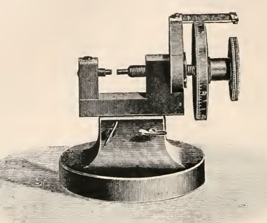 A picture containing appliance, table, small, sitting
Description automatically generated