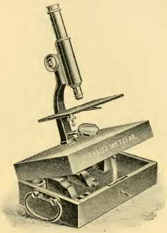 A picture containing sitting, old, photo, table
Description automatically generated