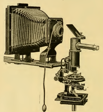 A picture containing sitting, sign, street, old
Description automatically generated