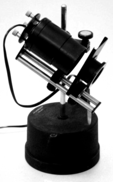 A picture containing cylinder, telescope, indoor
Description automatically generated