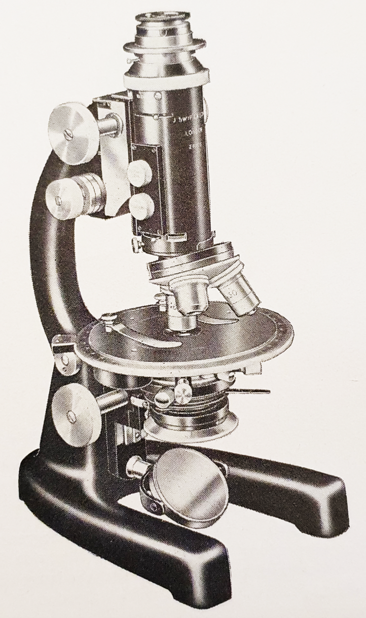 A close-up of a microscopeDescription automatically generated