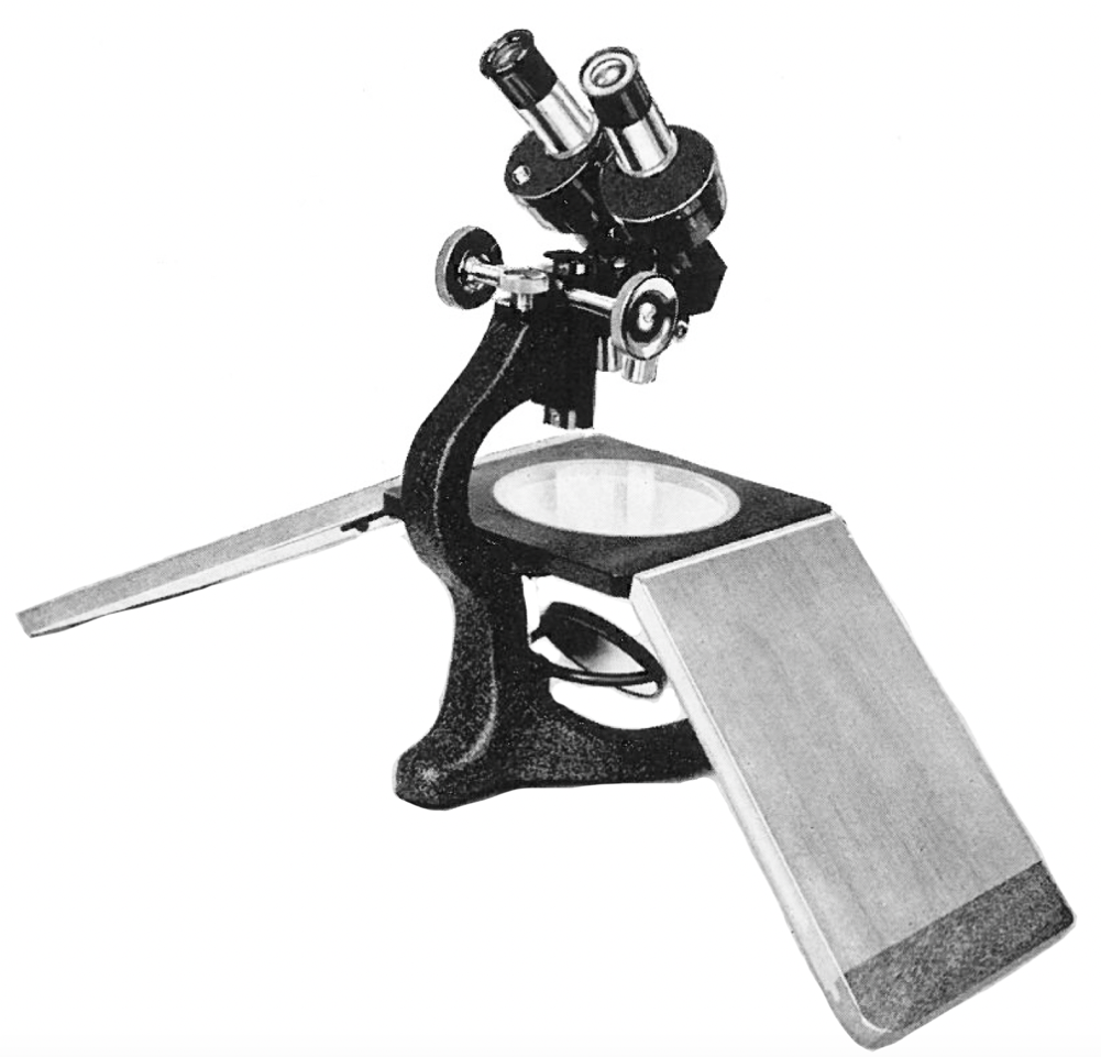 A microscope with a magnifying glassDescription automatically generated ...