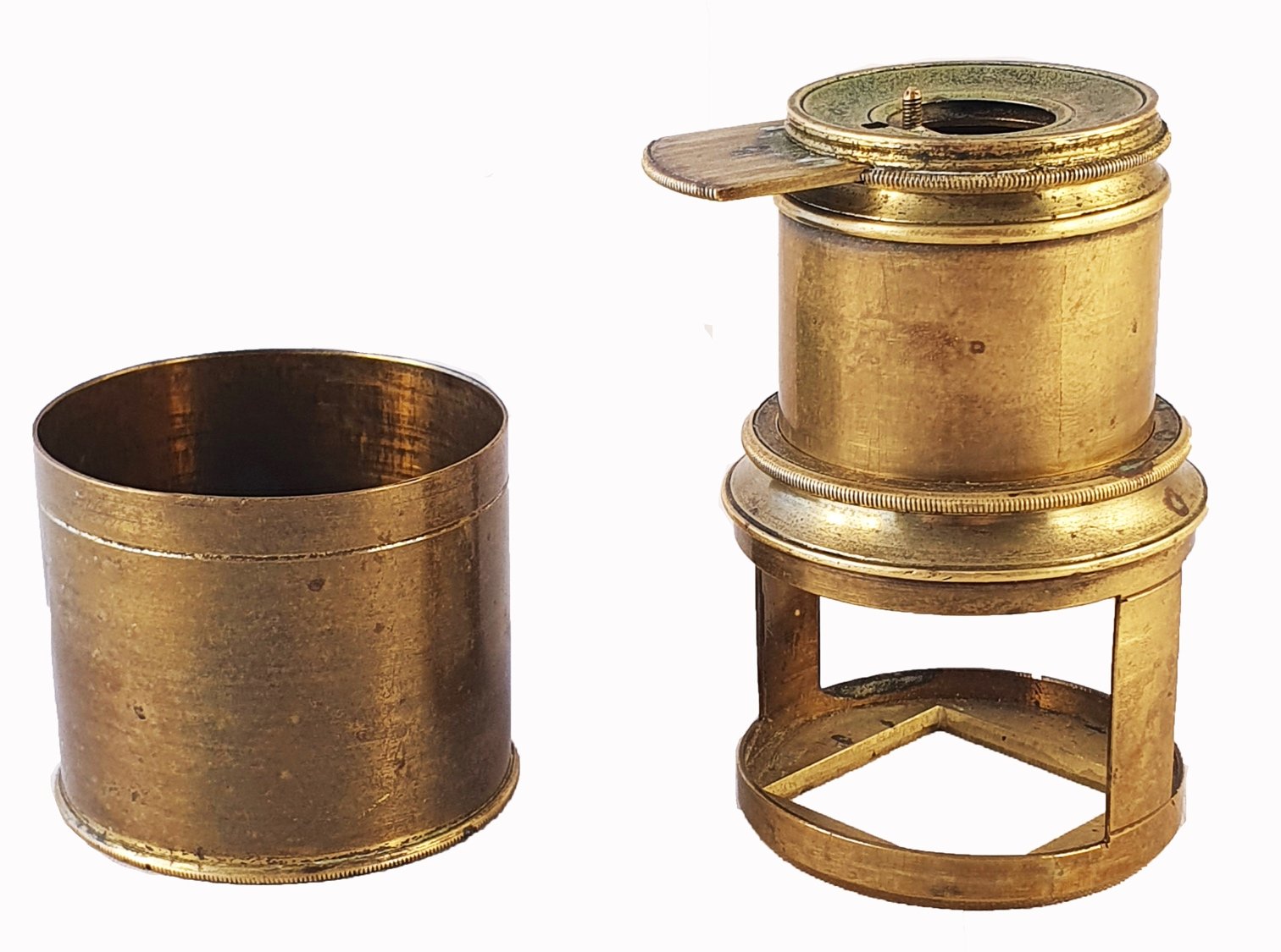 A close-up of a brass containerDescription automatically generated