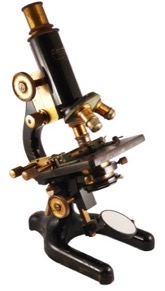 A picture containing table, sitting, black, man
Description automatically generated