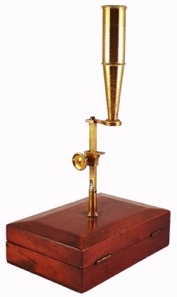 A picture containing indoor, table, sitting, wooden
Description automatically generated