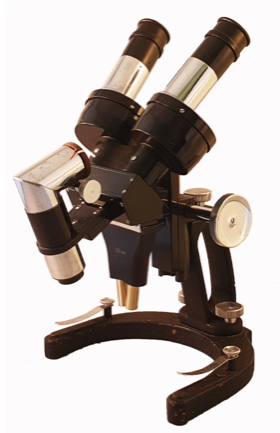A black and silver microscope
Description automatically generated
