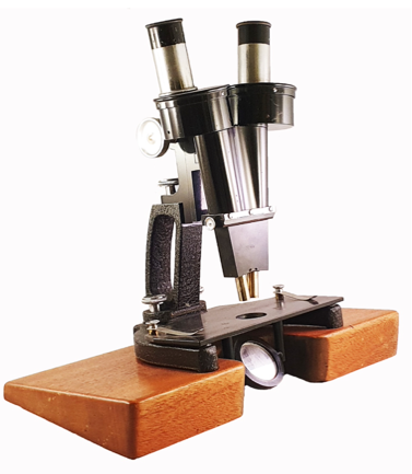 A microscope with a black handle
Description automatically generated
