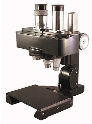 A black and silver microscope
Description automatically generated