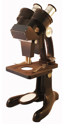 A close-up of a microscope
Description automatically generated