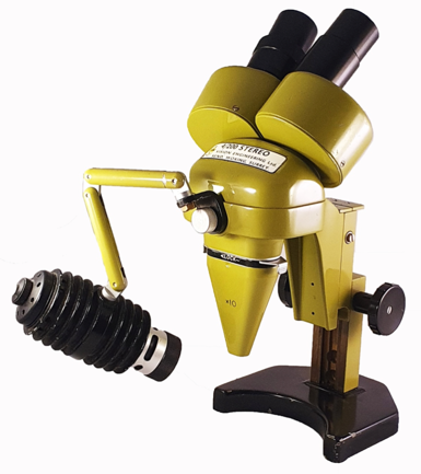 A yellow microscope with black tubes
Description automatically generated