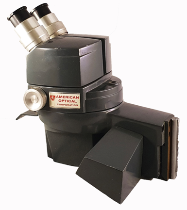 A close-up of a microscope
Description automatically generated