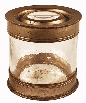 A glass container with a round lid
Description automatically generated